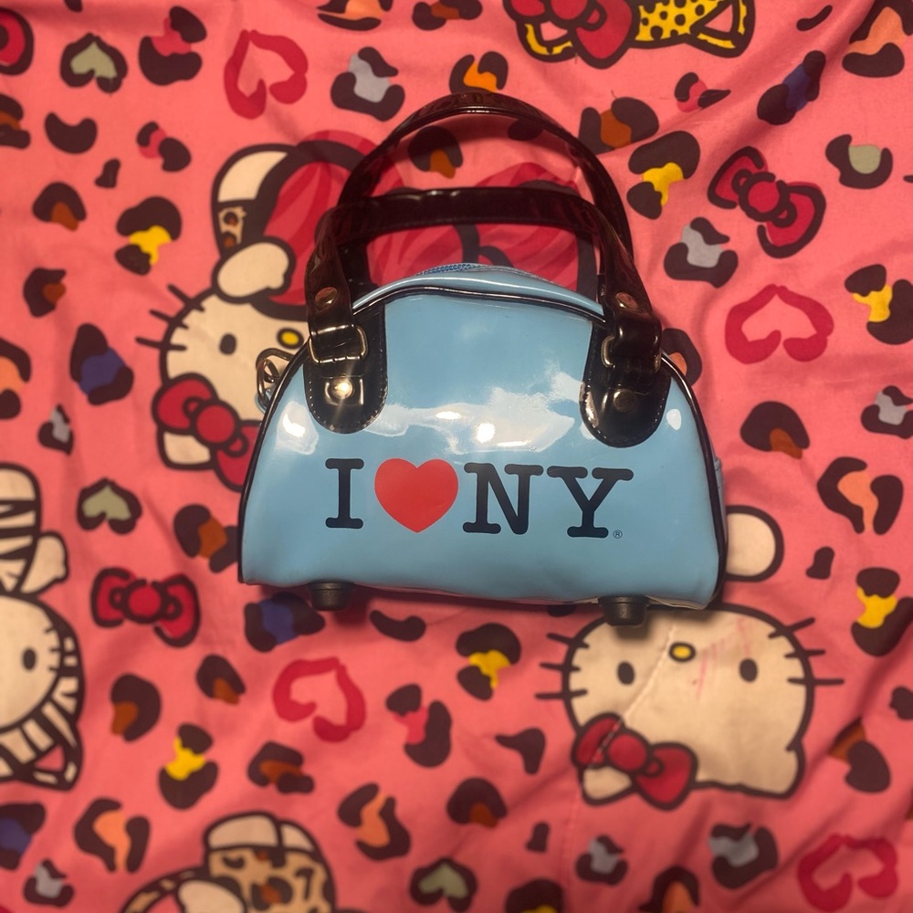 Blue mini “I ❤️ NY” bag, with black holders🗽